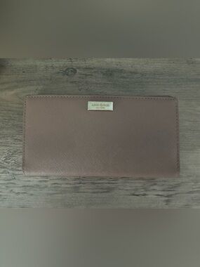 kate spade long bifold wallet in dusty mauve